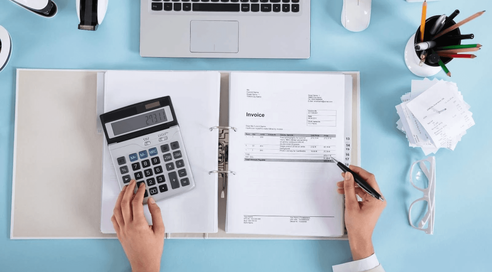  Overhead view of person processing invoices - How to Invoice as a Freelancer