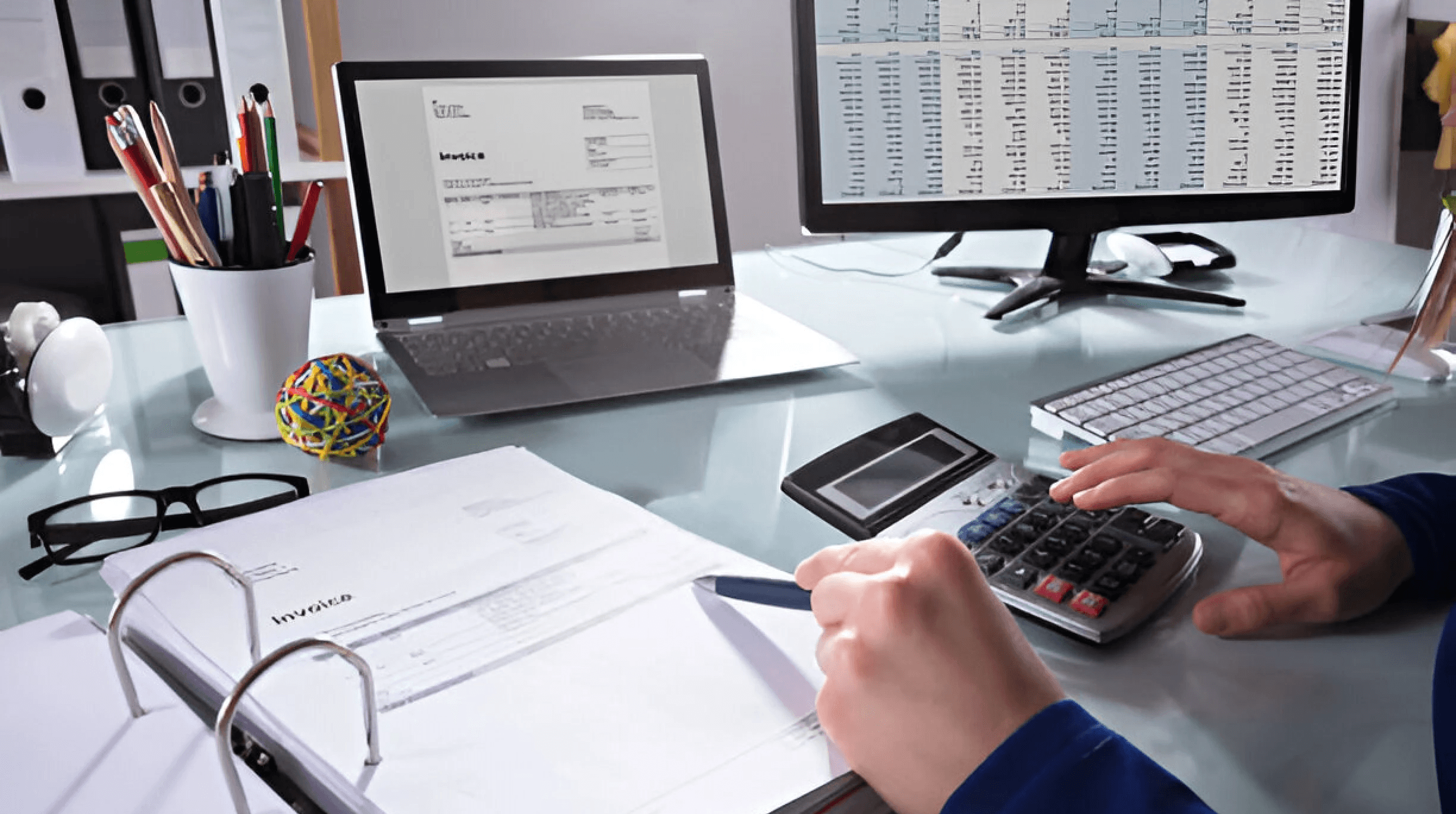 Person calculating financial invoices - How to Invoice as a Freelancer